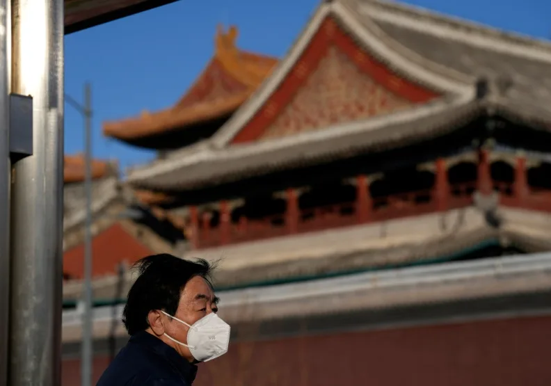 圖／北京街頭戴口罩的民眾。達志影像