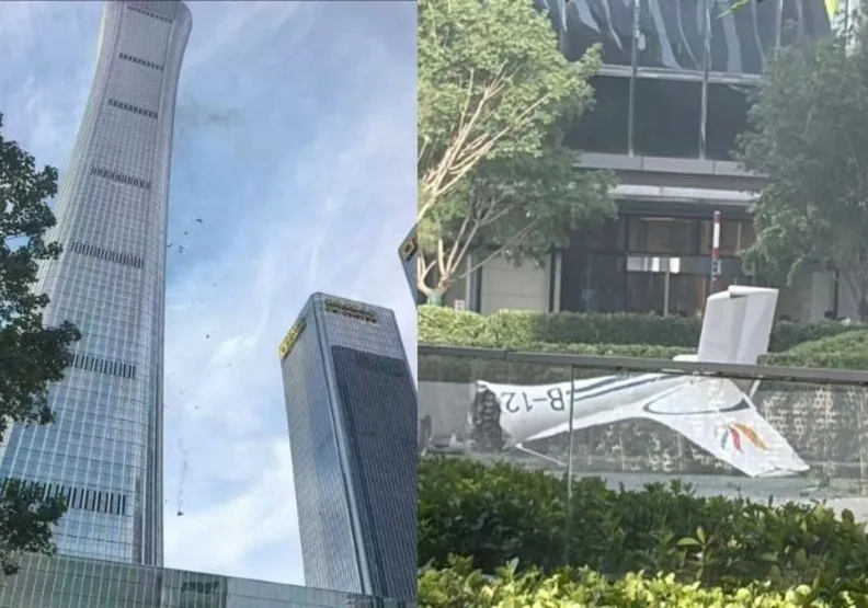北京「中國尊」傳疑遭小飛機撞擊，地面散落疑似飛機殘骸。取自網路影片